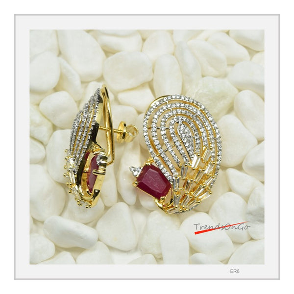 Gold Toned White Stone Earrings - Peacock shaped Studs has white American Diamonds & Red Gem